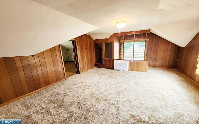 Upper-level rec room with heat/cool mini split, commercial blinds and new carpeting