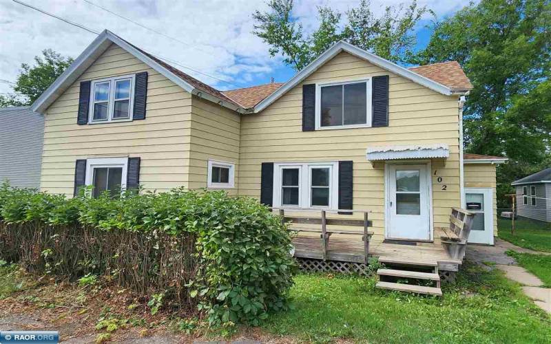 Steel siding, newer roof and front wood deck. View from 1st Ave S