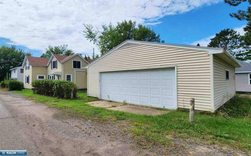 2-stall garage with newer roof, vinyl siding and aluminum soffits, fascia and gutters.