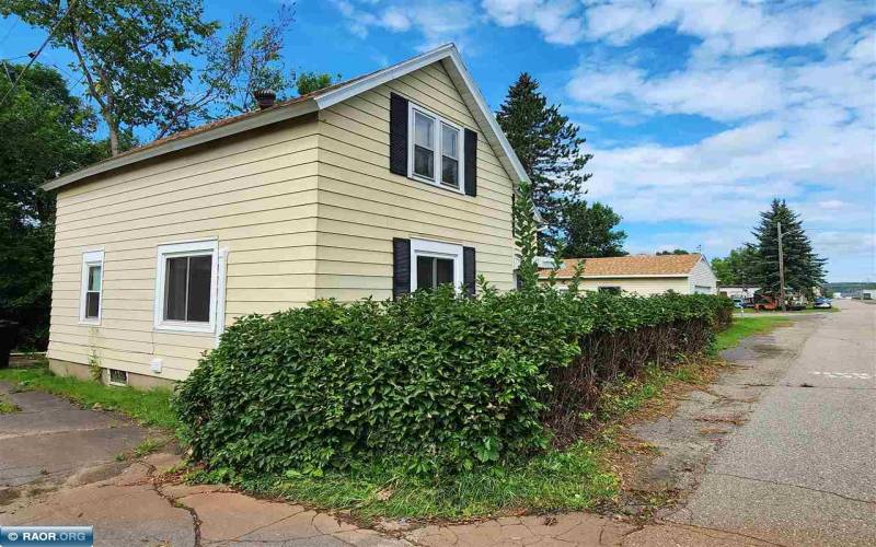 Alley side view - Newer roof and steel siding