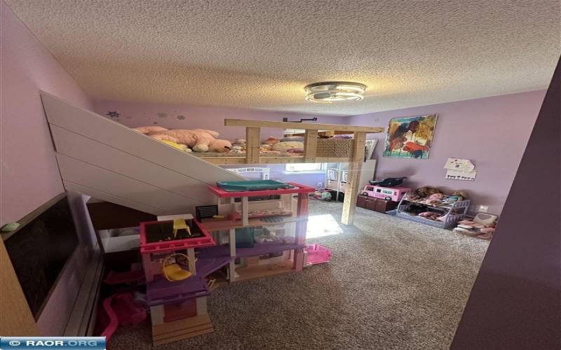 Bedroom is currently in use as a playroom.