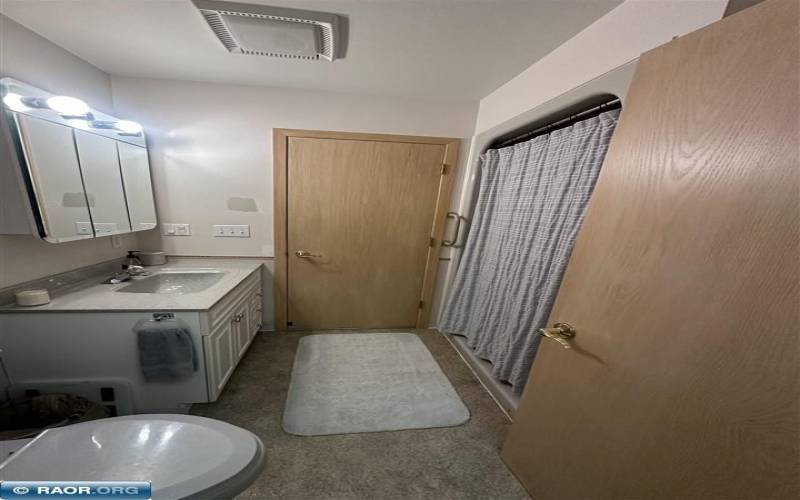 This bathroom is accessible through Master Bedroom and Kitchen.